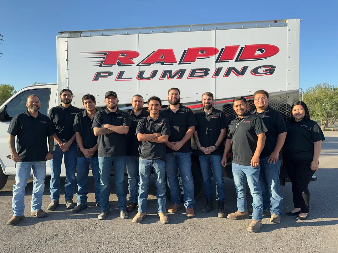 The Rapid Plumbing crew in front of a company box truck